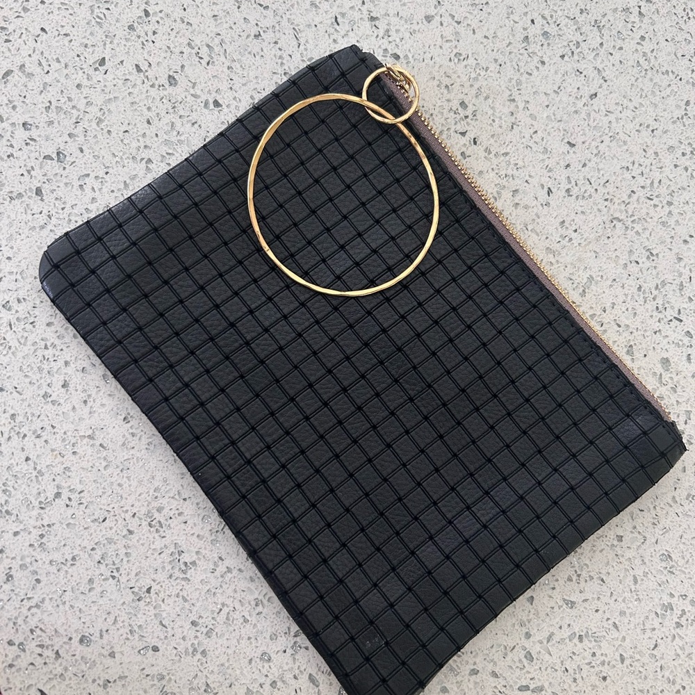 Rebecca Norman Wrist Black Grid Pattern Clutch NWOT. Soft black Leather